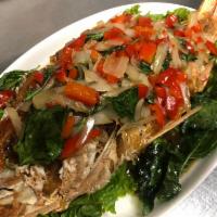 Pla Ga Prow · Crispy whole red snapper sauteed with Thai spicy basil sauce w/ bell pepper and onion. Serve...