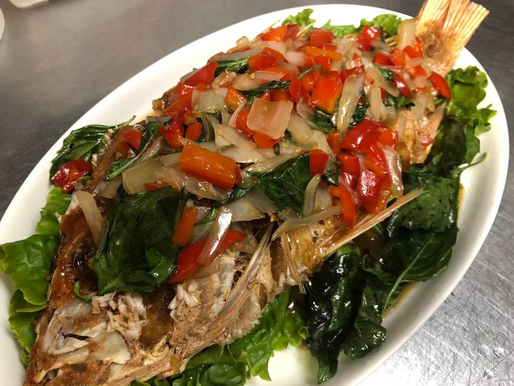 Pla Ga Prow · Crispy whole red snapper sauteed with Thai spicy basil sauce w/ bell pepper and onion. Served w/ rice.