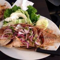 Larb Pla Grob · Crispy whole red snapper served with larb sauce.