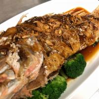 Pla Makham · Crispy whole red snapper with special tamarind sauce, topped with fried red onion, served w/...