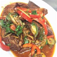 Duck Pad Ped · Crispy duck (Half) sauteed with Thai eggplant, pickled peppercorns, bell pepper,
basil, wild...