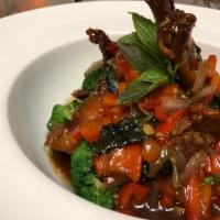 Duck Ga Prow · Crispy duck (Half) sauteed with Thai spicy basil sauce w/ bell pepper and onion. Served w/ r...