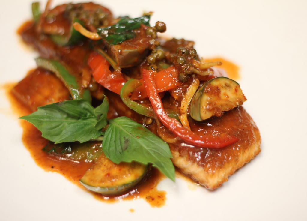 Salmon Pad Ped · Pan fried salmon with Thai eggplant, pickled peppercorns, bell pepper,
basil, wild ginger w/ spicy curry paste. Served w/ rice.