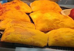 Jamaican Patty · Beef filled patty. Served in two.