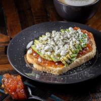 Specialty Avocado Toast · Tomato jam, sliced avocado, topped with goat cheese, salt and pepper.