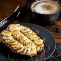 The Bob Marley Toast · Almond butter, sliced banana and hemp seeds topped with a drizzle of honey.