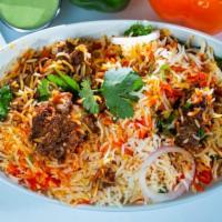 Goat Biryani · Long-grained basmati rice layered with marinated succulent pieces of goat cooked in a spicy ...
