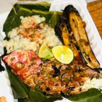 Roasted Snapper Meal · One whole roasted red snapper. Served with potatoes infused with okra and roasted plantains.