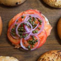 Lox Bagel · Served open faced with cream cheese, tomatoes, onion and capers.