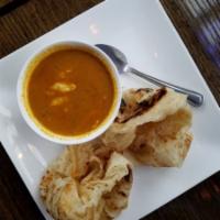 Roti Canai · 2 pieces of roti with curry chicken dipping sauce. Extra roti for an additional charge.
