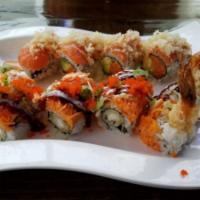 Mets Roll · Spicy salmon and avocado topped with salmon, tempura flake and spicy mayo.