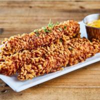 Crispy Rice Chicken Sticks · Chicken tender fried with crispy rice puffs with parsley on the top /
Honey Mustard On the s...