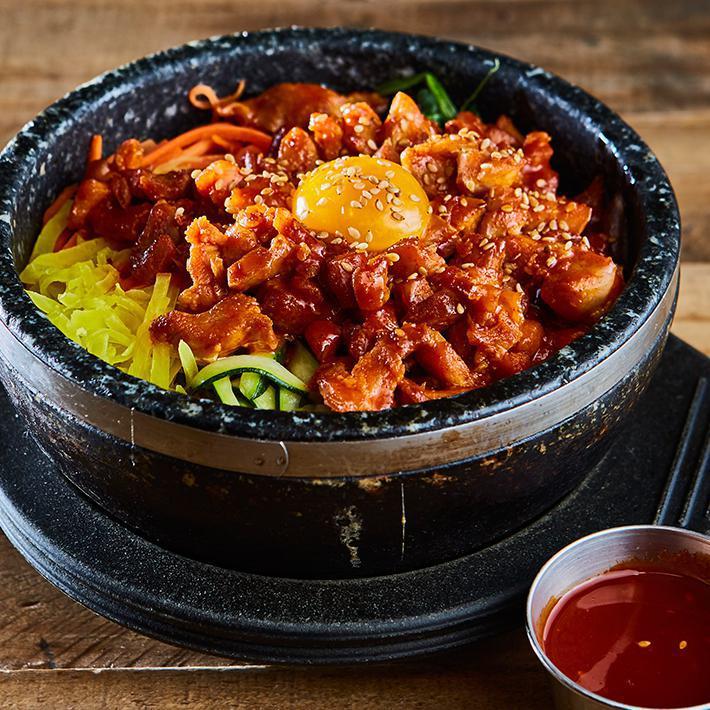 Spicy Chicken Bibimbap · Pan fried spicy chicken on the top / steamed rice served with cooked vegetables (carrot, spinach, zucchini, mushroom, pickled radish, egg yolk, sesame seed on the top) served with red pepper paste on the side

* Delivery served with fried egg