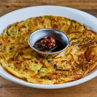 Haemul Jeon (Seafood Pancake) · Pan fried flour mixed with seafood mix served with jalapeno soy sauce on the side