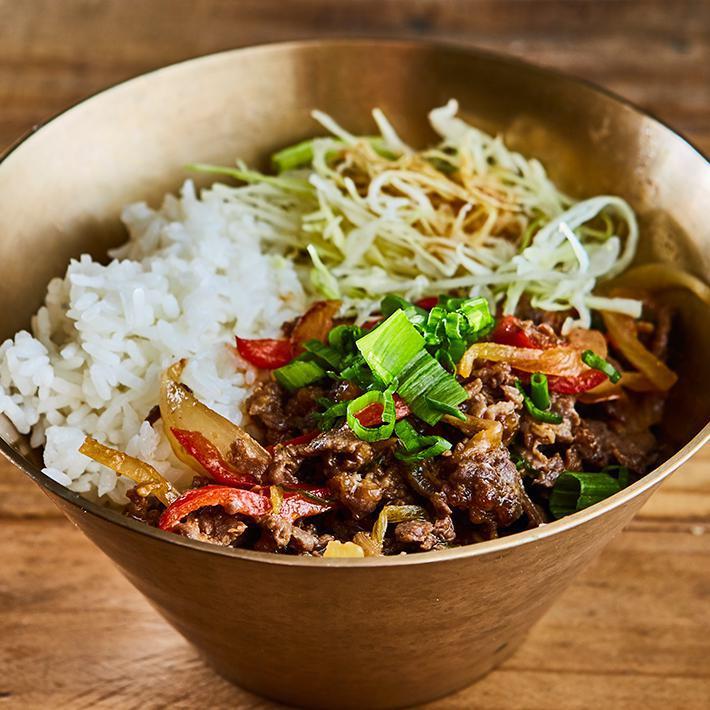 Bulgogi Rice Bowl · Steamed rice served with pan fried Bulgogi (Korean style marinated beef based on soy sauce) and vegetable (red pepper, scallion, onion, cabbage) on the top
