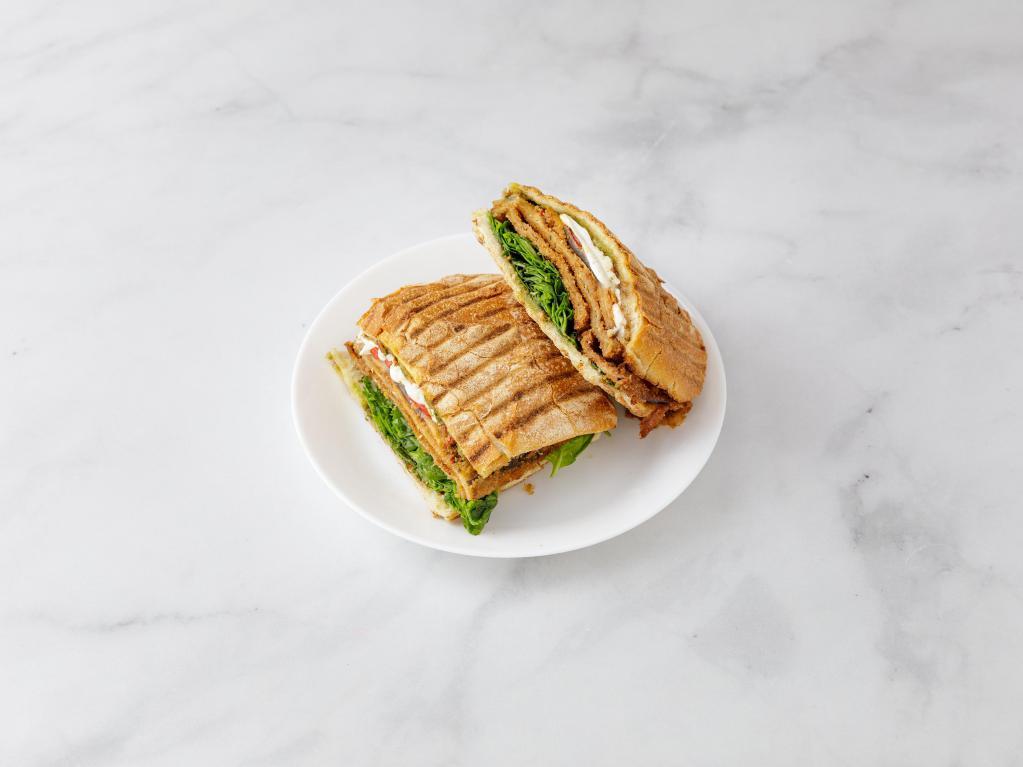 Capri Panini · Breaded eggplant with roasted peppers, fresh mozzarella, fresh spinach leaves and a pesto balsamic glaze.