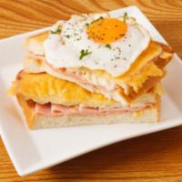 French Toast with Ham and Eggs · Scrumptious French toast, eggs, and hearty ham.
