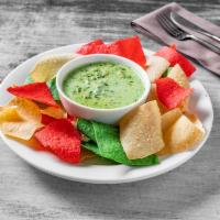 Spinach & Artichoke Dip · Served with tortilla chips.