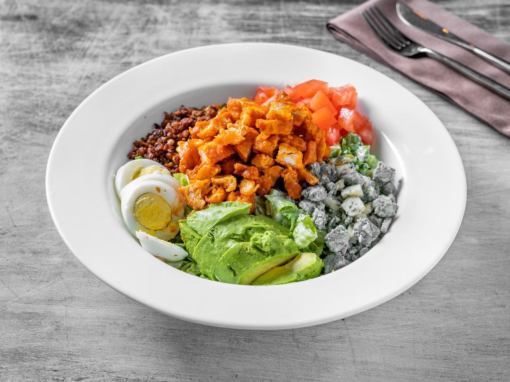 Buffalo Chicken Cobb Salad · Buffalo chicken, chopped romaine, hard boiled eggs, bacon, tomatoes, avocado & blue cheese crumbles tossed in ranch dressing.