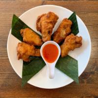 Chicken Wings · Crispy chicken wings with sweet chili sauce.