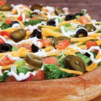 Nacho Pizza · Vegetarian. Taco sauce, refried beans, black olives, tomatoes, jalapeños, lettuce, sour crea...