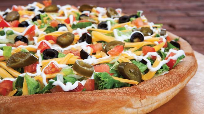 Nacho Pizza · Vegetarian. Taco sauce, refried beans, black olives, tomatoes, jalapeños, lettuce, sour cream, cheddar cheese and mozzarella cheese.