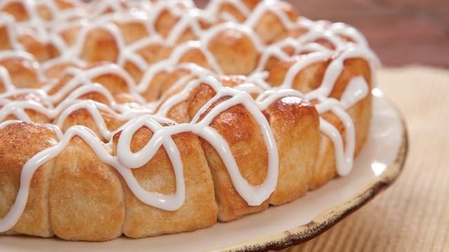 Cinnamon Monkey Bread · Others try, but no one can copy our bite-sized pieces of oven-baked dough sprinkled with sweet cinnamon and sugar, then drizzled with decadent icing.