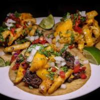 Steak Tacos · 3 tacos made with steak topped with pico de Gallo, guacamole, green salsa and cilantro.