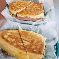 Cuban Panini · House braised pork shoulder, applewood smoked ham, imported Swiss cheese, sweet and spicy pi...