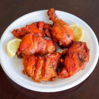 39. Chicken Tandoori · Chicken legs cooked in a clay oven. Served with basmati rice.