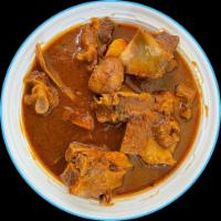 41. Goat Curry · Goat cooked with curry and spices. Served with basmati rice.