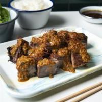 Entrée Yunnan Brisket · Braised and Seared, Chili Garlic Mint Sauce
Marinated Cucumbers