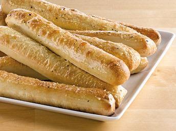 Garlic Parmesan Breadsticks · Long stick shaped baked bread. 