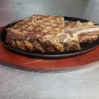91 .Chuleton de Res a la Plancha  / Beef  chop in the grilled · arroz habichuela y papas fritas
