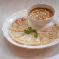 Mussamun Roti · Thick mussamun curry sauce with potatoes served with pan fried flatbread.