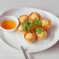 Stuffed Crab Rangoon · Homemade wonton filled with cream cheese, crab meat and chopped onion served with sweet chil...