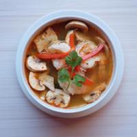 Tom Yum Goong Soup · Savory traditional shrimp soup, spiced with exotic Thai herbs, mushrooms, lime juice, lemong...