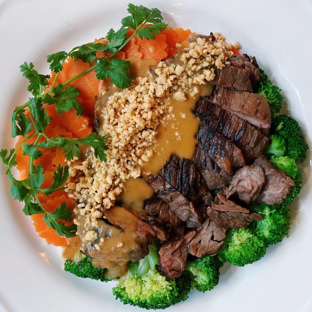 Grilled NY Strip Steak peanut curry · Grilled NY Strip with peanut curry broccoli and carrot  served with jasmine rice