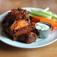 Chicken Wings · Choose from hot, mild, BBQ or dry rub with celery, carrots and bleu cheese.