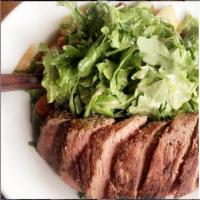 House Steak Salad · Grilled strip steak, arugula, roasted potatoes, grilled onions, red beans, tomatoes, and hor...