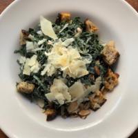 Spicy Kale Caesar Salad · Chopped kale, slivered almonds, chickpeas, parmesan, seeded sourdough croutons and spicy cae...
