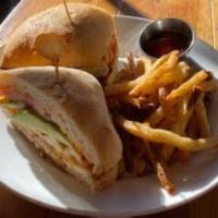 Grilled Chicken Sandwich · Grilled chicken, tomato, avocado, and melted cheddar cheese served with sriracha mayo on cia...