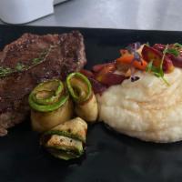New York Strip Steak · Served with mashed potato and sauteed vegetables