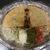 Quesadilla · Deep-fried flour tortilla topped with beans, meat, Monterey Jack cheese, tomatoes, mild chil...