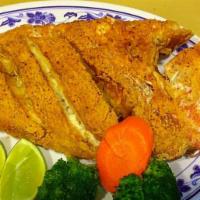Fried Red Snapper · Served with your choice of either fried rice, green plantains, sweet plantains or fries.