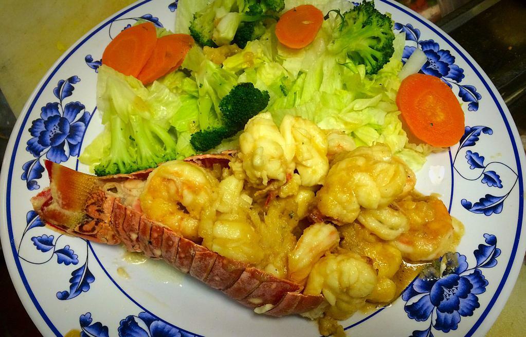 Lobster Tail with Shrimp on Top · Covered with chef's special sauce.