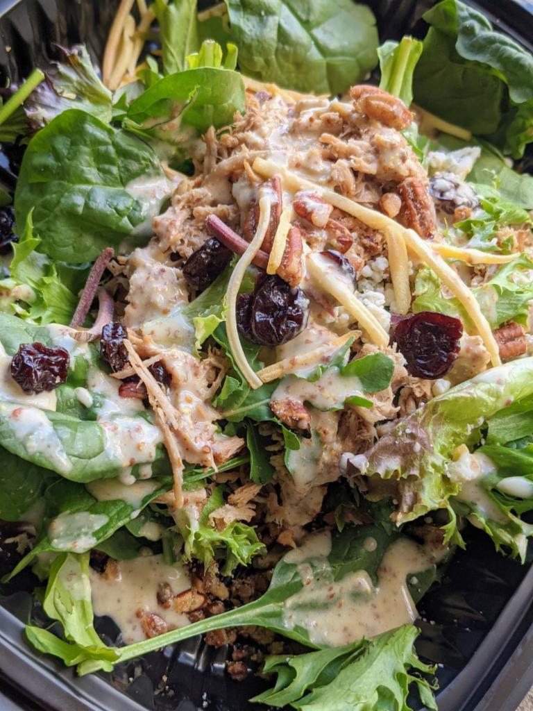 Salad 1 · Greens, shredded carrots, dried cranberries, candied pecans, bleu cheese and mustard vinaigrette.