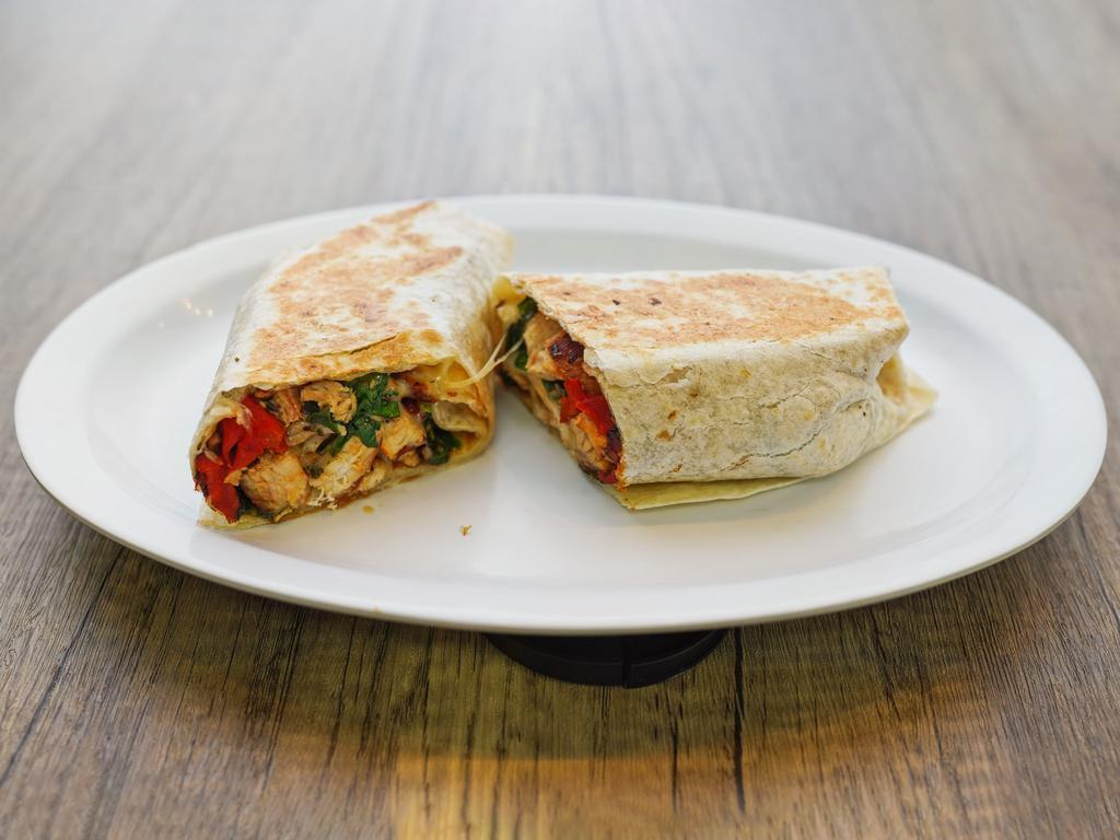 11. Tuscan Chicken Wrap · Grilled chicken, spinach, roasted peppers, mozzarella cheese, and balsamic vinegar.