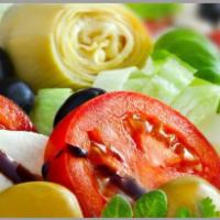 Caprese Salad · Imported Buffalo mozzarella, tomatoes, oregano and basil.