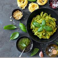 Pasta with Pesto alle Genovese · Sauce with basil, walnuts, almonds, pinenuts and parmigano cheese.